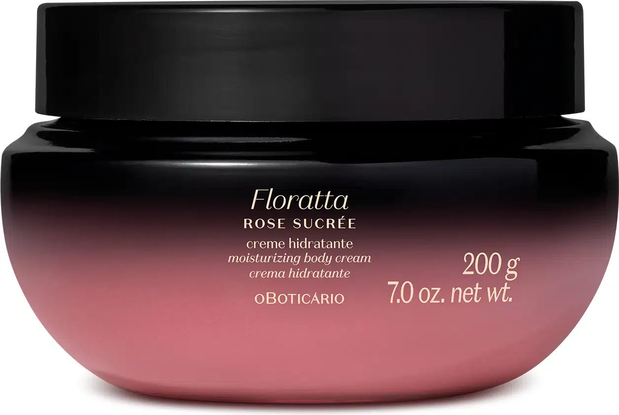 A imagem mostra um pote de creme hidratante corporal da marca Floratta Rose Sucrée. Ele possui um degradê que vai do preto para o roxo, tampa preta e rótulo com informações sobre o produto impresso em letras douradas.