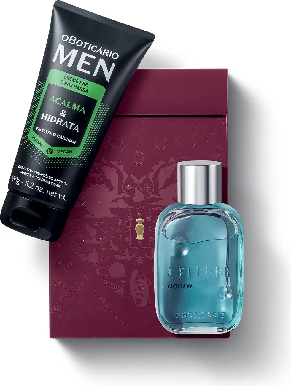 Caixa de presente de cor vinho com um grande coração contendo ilustrações em relevo de temática celestial. Ao lado, um item de perfumaria azul-turquesa com tampa prateada com a palavra CELEBRE em relevo no vidro, e uma bisnaga preta de creme da linha MEN.