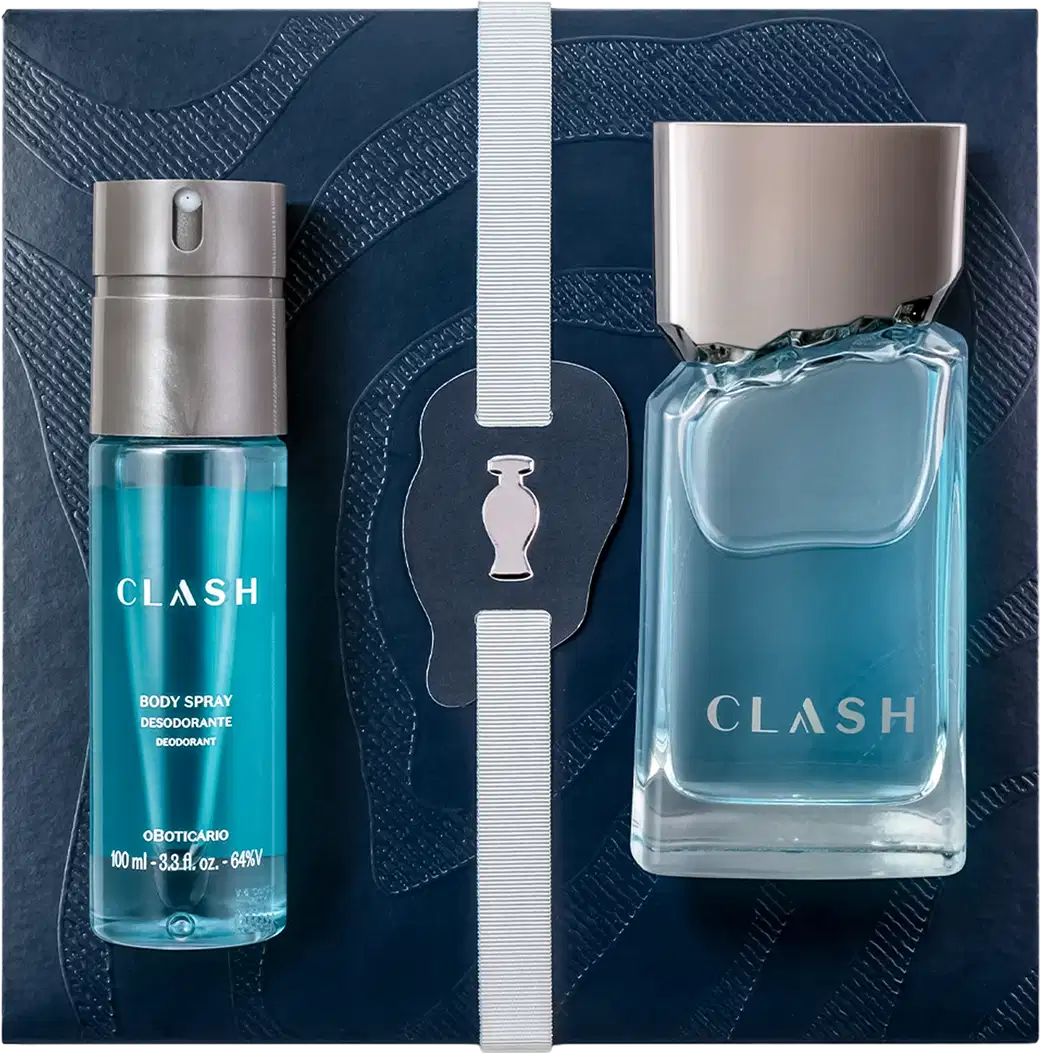 Caixa de presente azul-marinho com dois itens de perfumaria da marca Clash: um frasco de perfume e um frasco de desodorante corporal, ambos em tons de azul e cinza, sobre superfície escura.