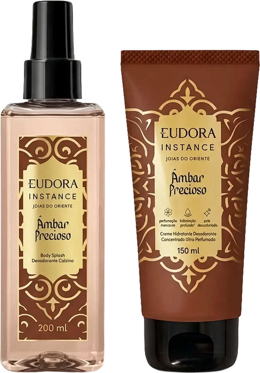 Eudora Instance Âmbar Precioso: Body Splash 200ml com frasco spray transparente e Creme Hidratante 150ml em tubo marrom. Embalagens com detalhes dourados e padrão ornamental. Produtos da linha Joias do Oriente.