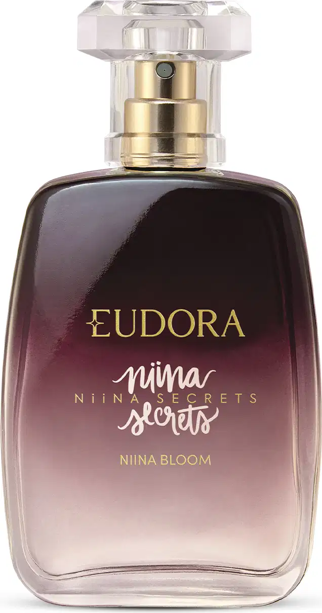 Frasco de perfume Eudora Niina Secrets Nina Bloom, com design elegante em tons de roxo e rótulo em tons de branco e dourado, contendo assinatura Niina Secrets.