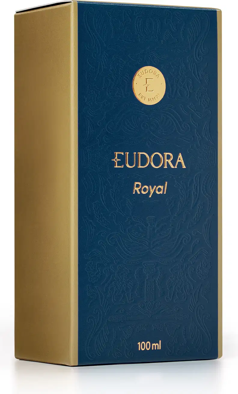 Caixa de Eudora Royal em azul escuro com detalhes dourados, contendo 100 ml do produto. A embalagem apresenta um padrão decorativo em relevo e o logotipo da marca Eudora.