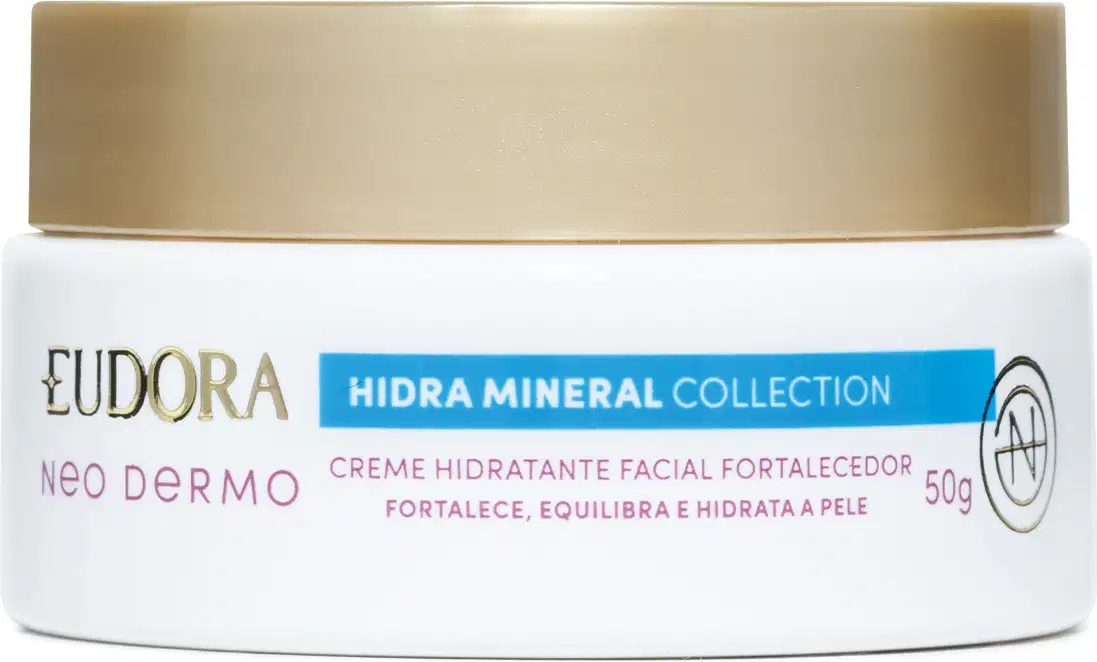 Embalagem tipo pote do Creme hidratante facial fortalecedor da linha Hidra Mineral da Eudora. Embalagem branca com tampa de rosquear dourada na parte superior, rótulo em tons de verde, vermelho e dourado no fundo branco.