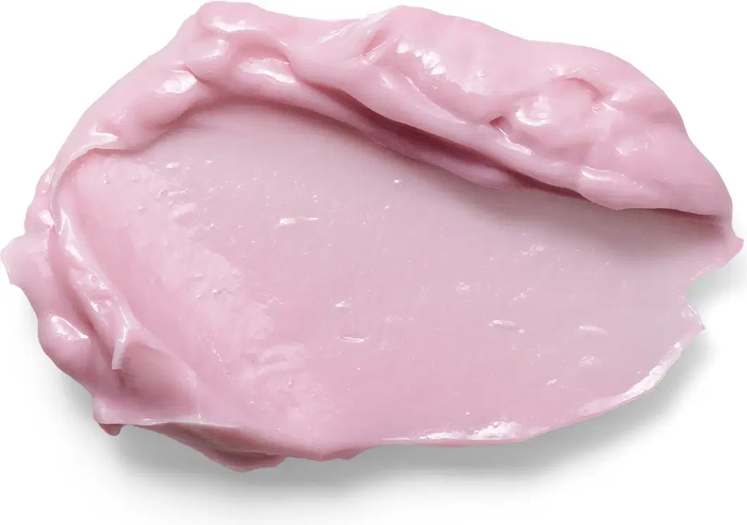 A imagem mostra uma porção do hidratante Eudora rosé. Sua textura é espessa e cremosa de cor rosa claro. A aparência viscosa e brilhante sugere que é um produto rico em nutrientes.