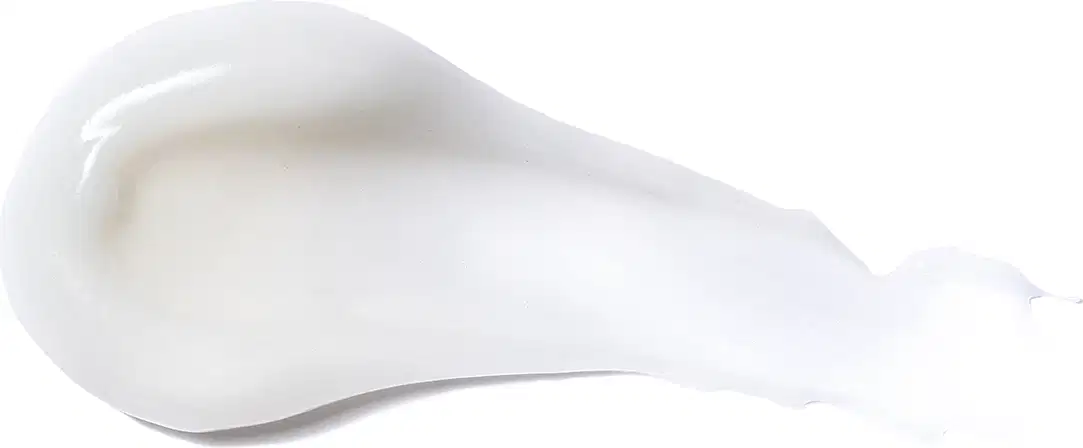 Textura do produto Creme para Pentear - Definição. Possui uma forma arredondada e suave, com uma superfície lisa e brilhante, em uma tonalidade branca. Não há rótulos ou textos visíveis na imagem, apenas a forma do produto em si.