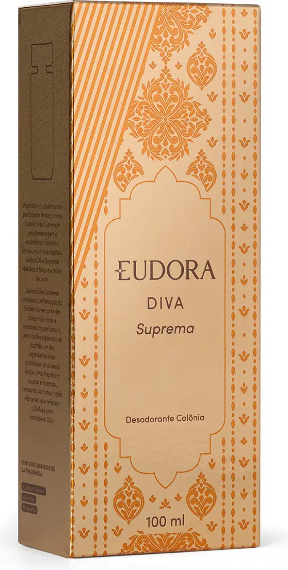 Embalagem do desodorante colônia da linha Diva Suprema da marca Eudora. A embalagem é uma caixa retangular de cor bege com detalhes em tons dourados, apresentando um padrão decorativo com elementos florais e geométricos.