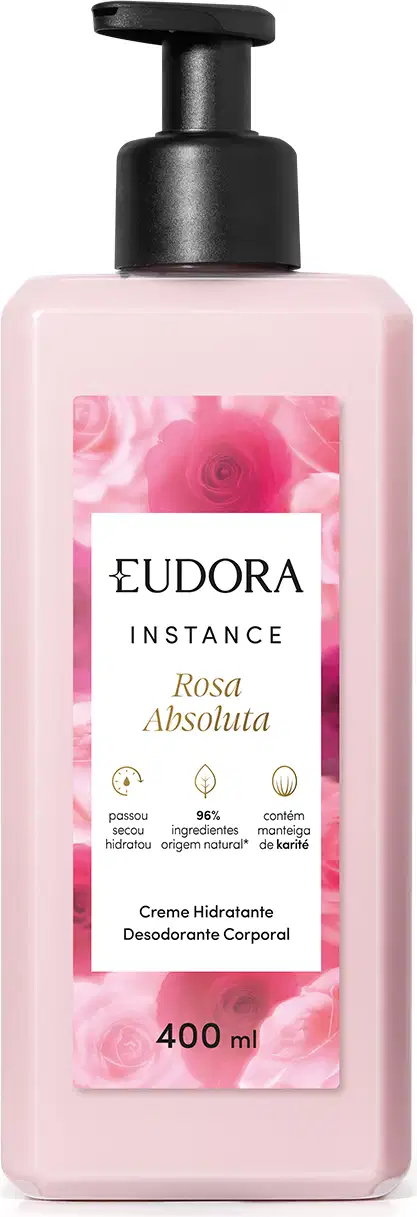 Creme hidratante desodorante corporal da linha Instance de Eudora. A embalagem é um frasco plástico rosa claro com um rótulo branco destacando o nome "Rosa Absoluta" e informações sobre o produto. O frasco possui um dispensador preto na parte superior.