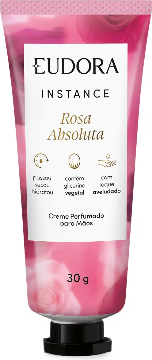 O produto apresentado é um creme perfumado para as mãos da linha Instance Rosa Absoluta. A embalagem é um tubo plástico rosa com rótulo branco que destaca algumas características do produto, como conter glicerina vegetal, ser hidratante e aroma de rosa.
