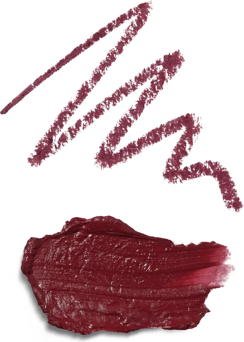 A embalagem não é visível na imagem, que mostra apenas a textura do produto. Na primeira, o risco da lapiseira delineadora e a segunda do batom, ambos na cor malva, com um tom marrom avermelhado profundo.