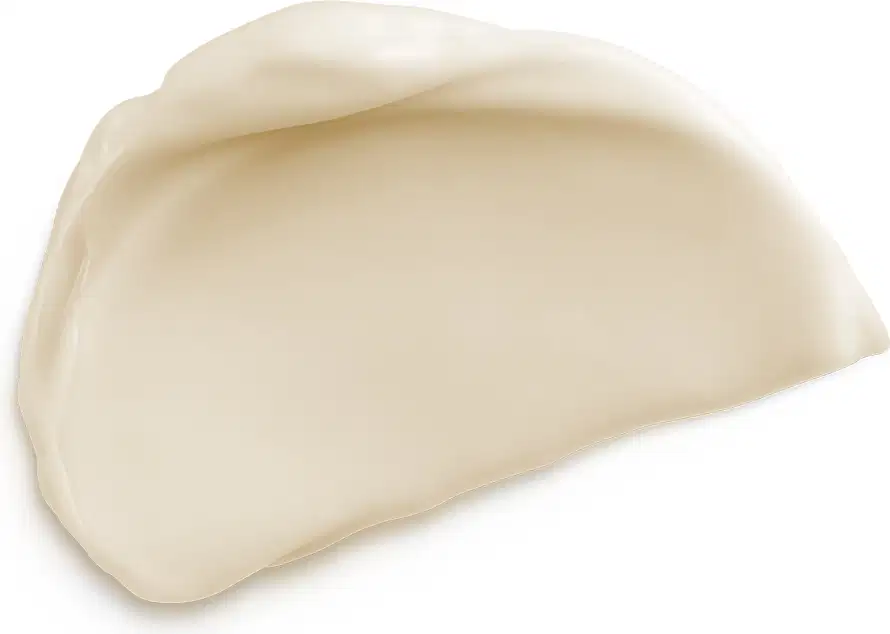 A imagem apresenta amostra do creme com textura cremosa de cor bege claro.