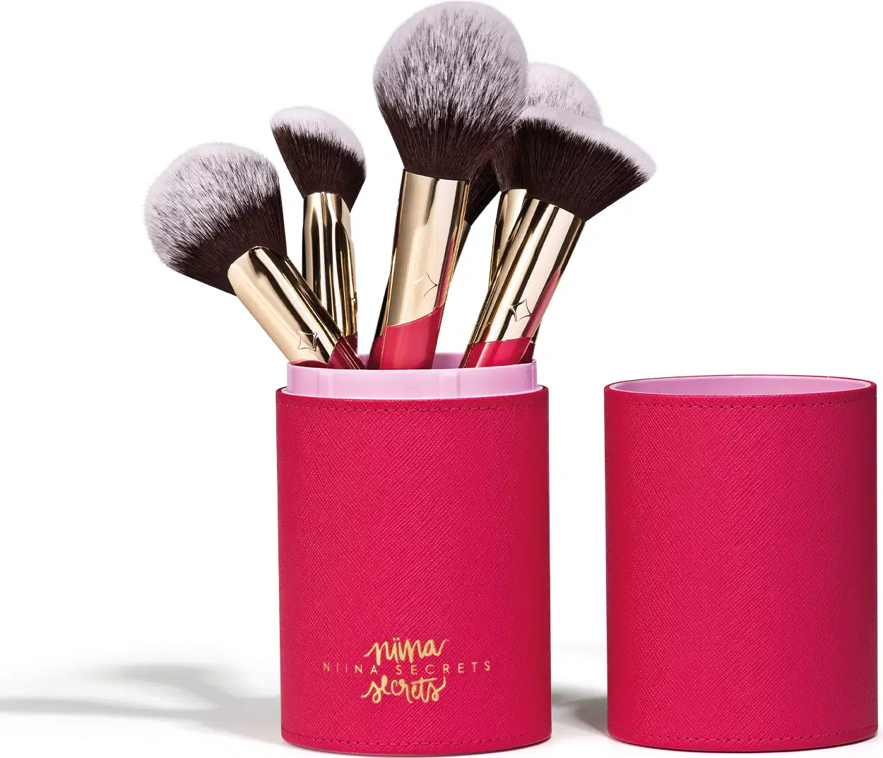Conjunto de pincéis de maquiagem da marca Niina Secrets em embalagem cilíndrica rosa Estojo Organizador para Pincéis Pink Case Niina Secrets, contendo diversos pincéis com cerdas pretas e douradas.
