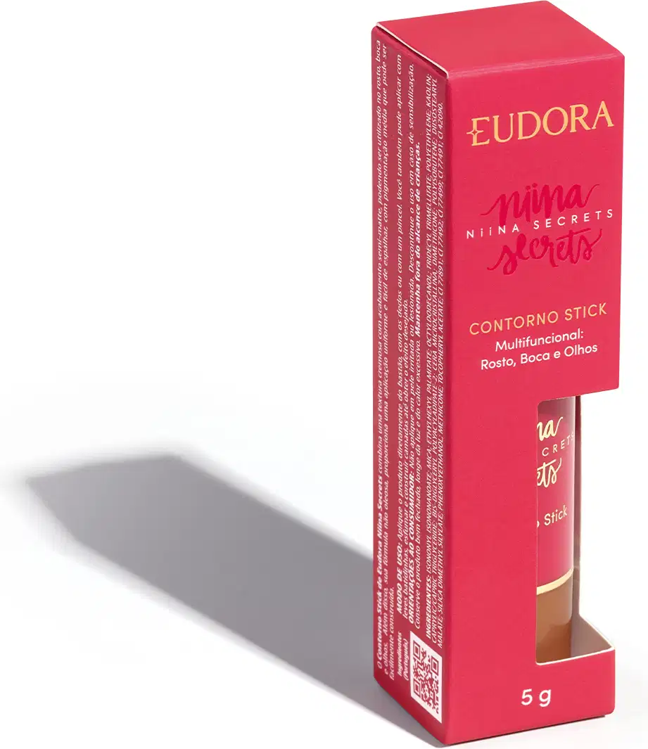A embalagem do Contorno Stick é uma caixa rosa com o nome da marca e da linha impressos em dourado. O produto em si é um bastão de maquiagem com uma tampa protetora.