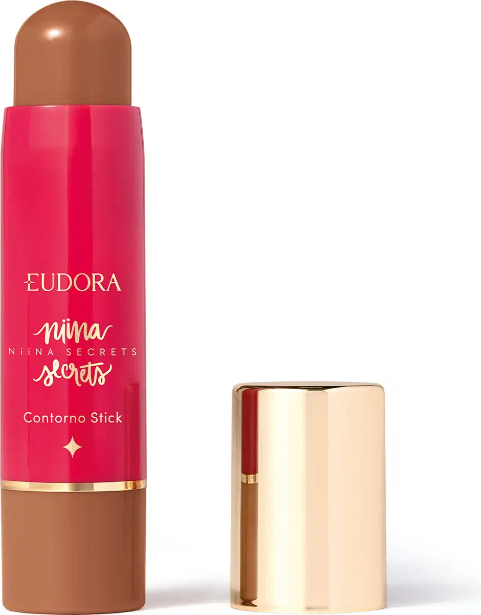 O produto apresentado é um contorno em bastão da linha Niina Secrets. A embalagem é cilíndrica e de cor rosa vibrante, com o nome da marca e da linha impressos em letras douradas. A embalagem também possui um detalhe dourado na parte superior.