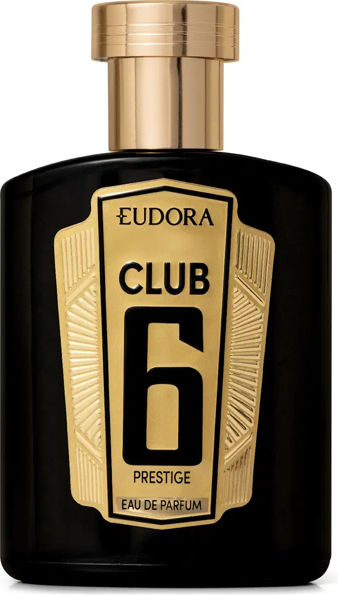 Frasco de item de perfumaria preto e dourado com rótulo destacado "Eudora Club 6 Prestige". O frasco possui formato retangular com detalhes geométricos dourados na tampa e na parte inferior. 