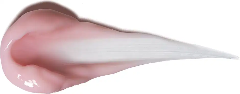 O produto apresenta uma textura cremosa, com tonalidade rosada e aparência suave e sedosa. Sua consistência é leve e fluida, sugerindo uma fórmula hidratante e de fácil aplicação.