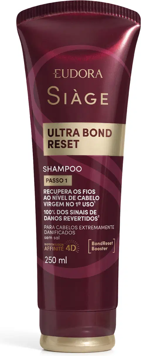 Frasco de shampoo da marca Siàge, na cor vinho, com rótulo em dourado contendo o texto "Ultra Bond Reset" e informações sobre recuperação dos fios.