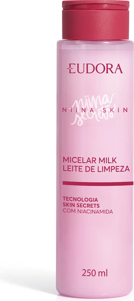 Frasco de leite micelar rosa da marca Eudora Niina Skin, com tampa pink, contendo 250 ml, com texto "Micelar Milk Leite de Limpeza" e "Tecnologia Skin Secrets com Niacinamida" visível no rótulo.