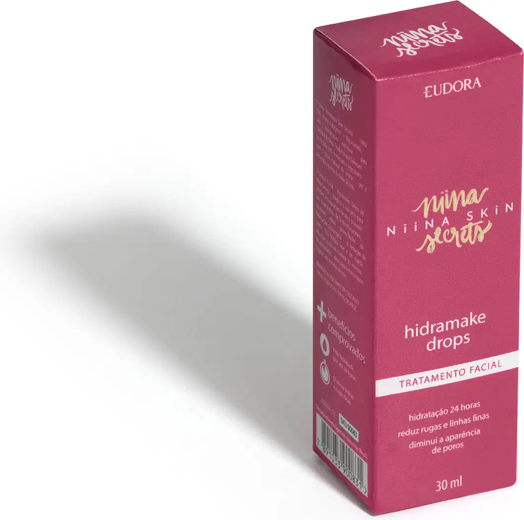Embalagem rosa de Hidramake Drops Tratamento Facial Eudora Niina Skin, frasco de 30ml com texto em dourado e branco, posicionado em perspectiva com sombra.