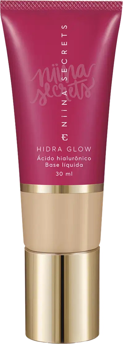 Tubo de base líquida Hidra Glow da marca Niina Secrets, com embalagem rosa e detalhes dourados, contendo 30 ml do produto.