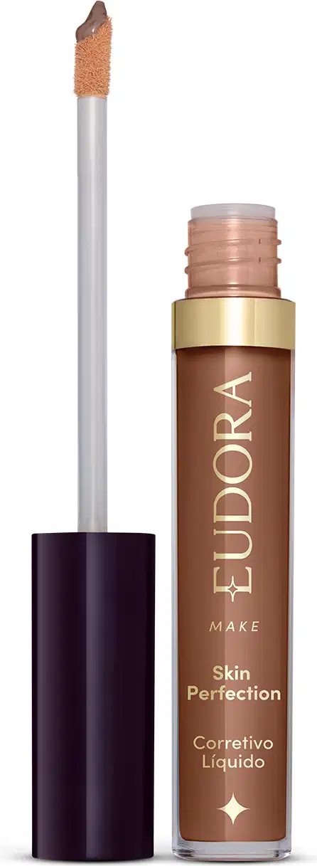 Produto de maquiagem da marca Eudora, com embalagem em tons de marrom e dourado. Trata-se de um corretivo líquido para a pele, o produto está aberto e mostrando como é o aplicador.
