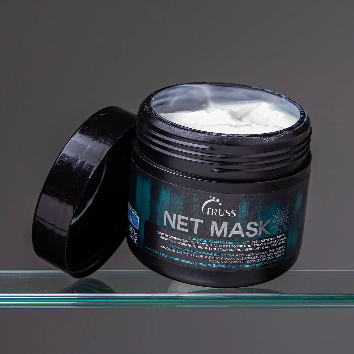 Produto de tratamento capilar da marca TRUSS. Embalagem em pote plástico preto brilhante com tampa removível. Rótulo na parte frontal com o nome "NET MASK" em letras grandes.