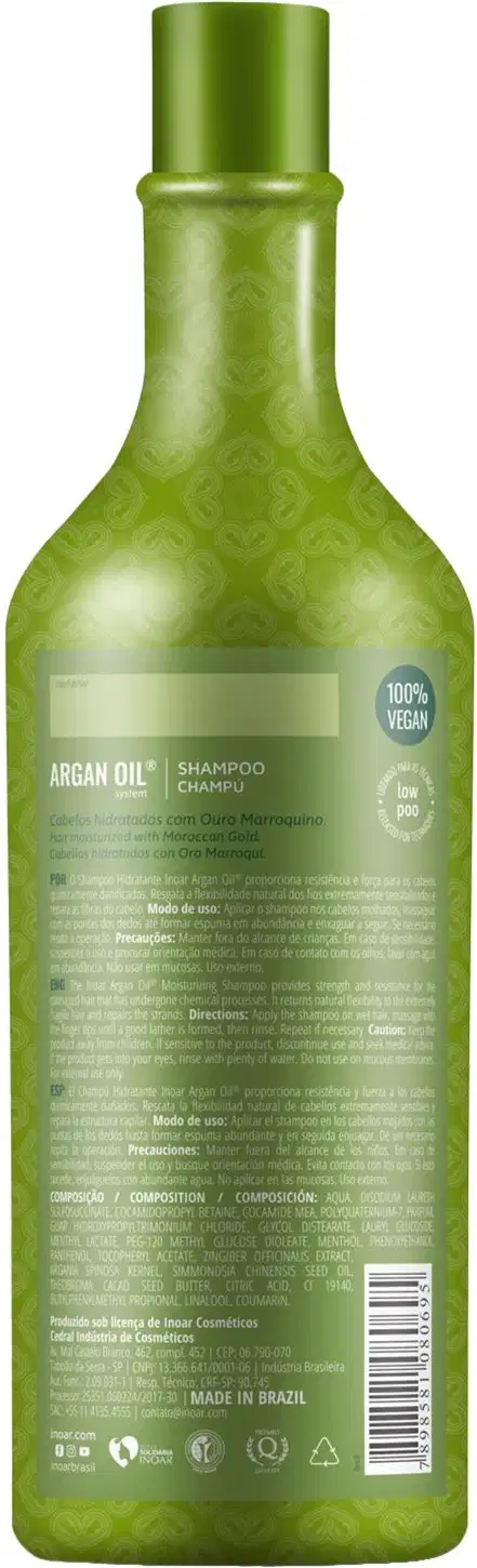 Shampoo de óleo de argan da marca Inoar. Embalagem em frasco plástico verde translúcido com formato cilíndrico alongado e tampa verde. Rótulo frontal com informações do produto como "Argan Oil Shampoo", "100% Vegan" e composição.