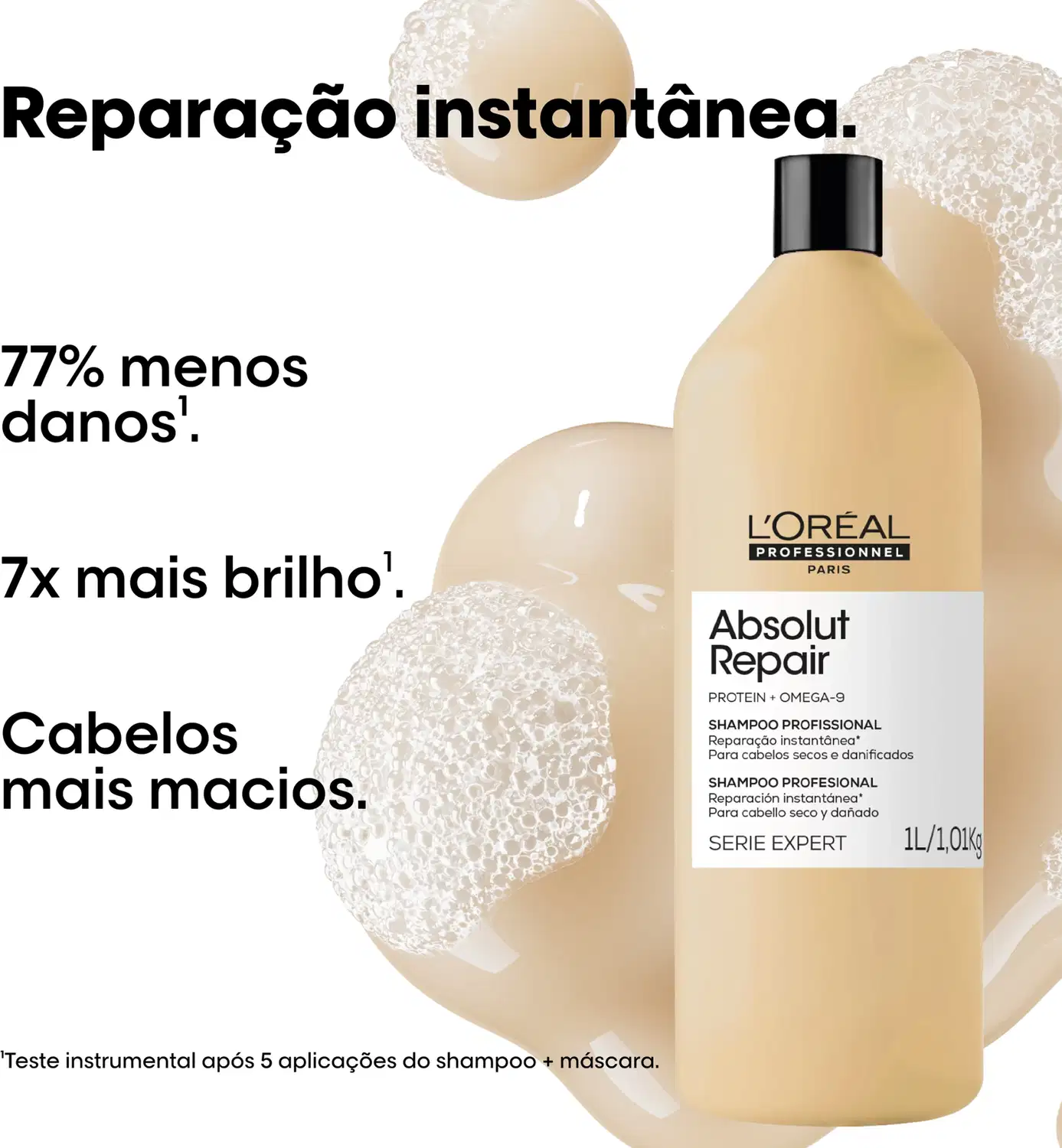 Produto de beleza da L'Oréal Professionnel, embalagem preta e branca, frasco de shampoo com rótulo "Absolut Repair" e informações sobre os benefícios do produto, como reparação instantânea e cabelos mais macios.