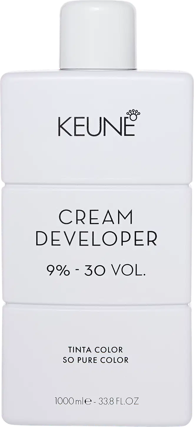Frasco branco da marca Keune, contendo Cream Developer com 9% - 30 VOL. O rótulo apresenta o nome da marca e do produto em letras pretas.