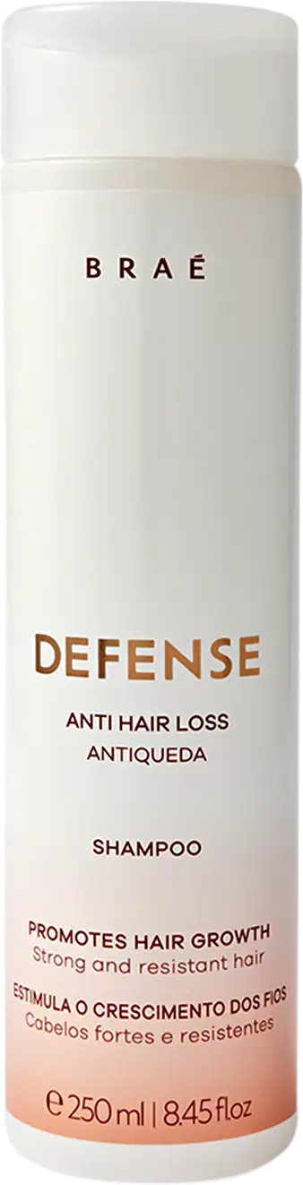 Frasco branco cilíndrico da marca Braé, contendo 250 ml de shampoo "Defense Anti Hair Loss Antiqueda" para promover o crescimento capilar.