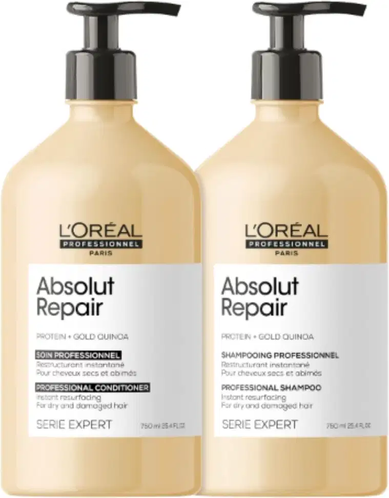 Shampoo e condicionador da linha Absolut Repair da L'Oréal Professionnel, com embalagens de plástico bege e detalhes em preto, contendo informações sobre os ingredientes e benefícios do produto.