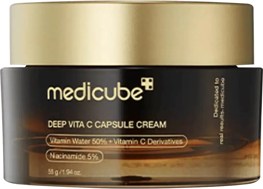 Creme Medicube Deep Vita C Capsule em frasco de vidro com tampa dourada. Embalagem preta com detalhes em ouro. Contém Vitamina C 50%, derivados de Vitamina C e Niacinamida 5%. Capacidade 55g.