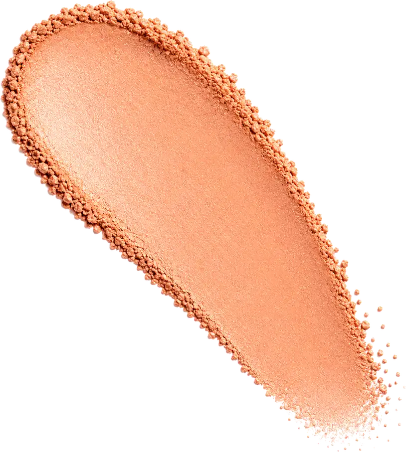 Amostra de blush em pó em tom alaranjado, aplicado em superfície branca.