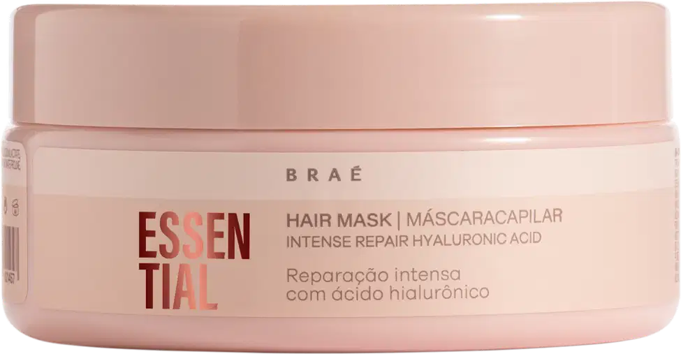 Máscara capilar em embalagem plástica rosa claro. A embalagem tem formato cilíndrico com tampa removível.