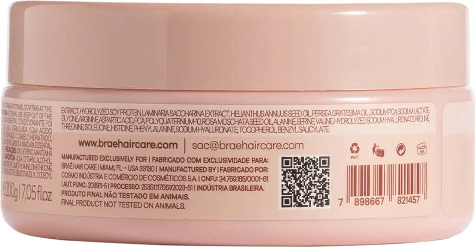 Pote plástico rosa claro com máscara capilar. Embalagem redonda com tampa rosada. Rótulo na parte inferior com informações do produto em português e inglês, incluindo ingredientes, código de barras e indicação de não testado em animais.