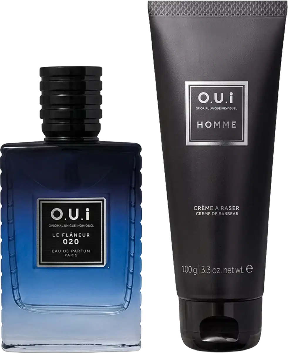 Conjunto O.U.i composto por frasco azul degradê de Eau de Parfum Le Flâneur 020 com tampa preta e tubo preto de Crème à Raser Home 100g, ambos com rótulos brancos e pretos.