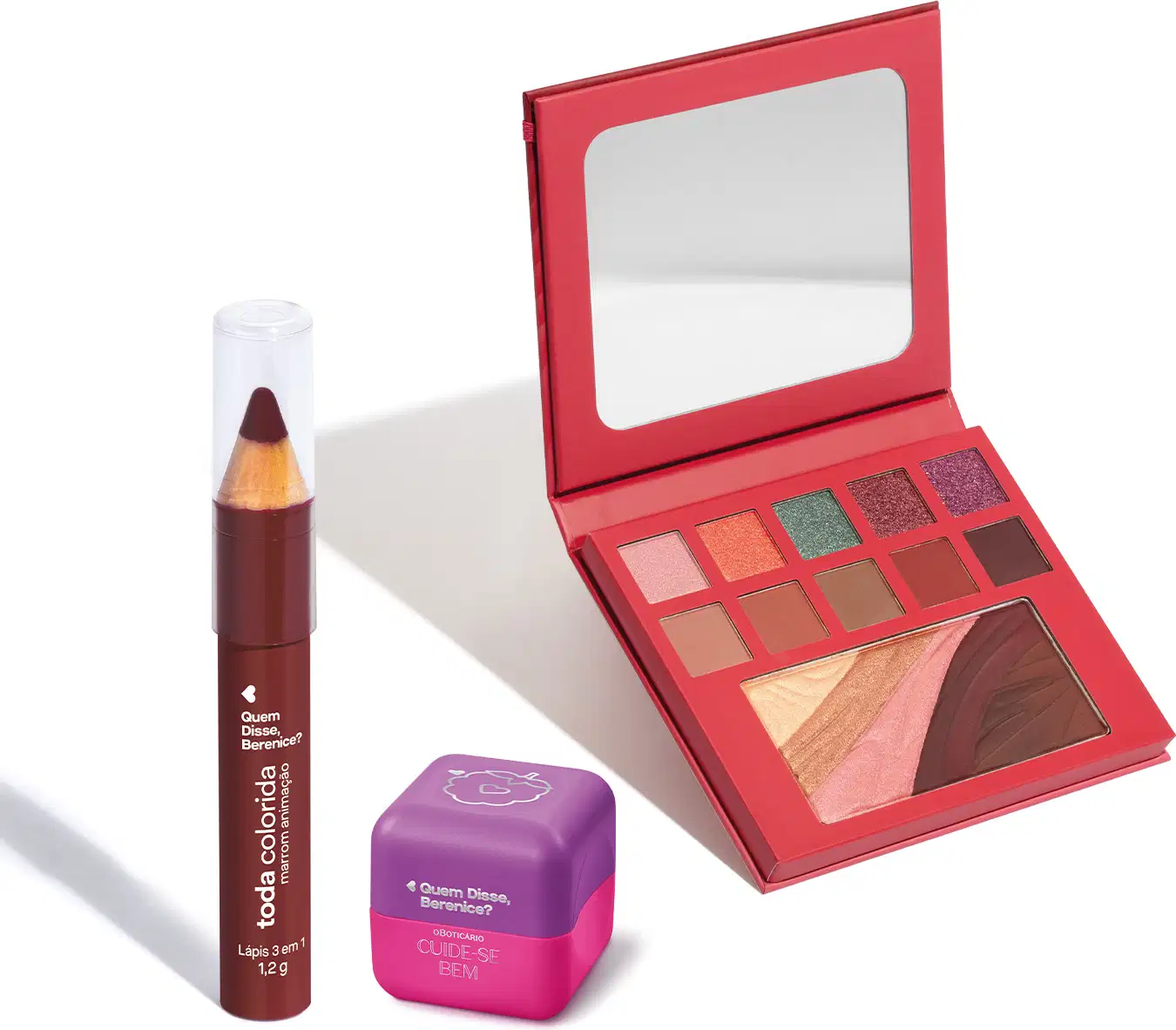 Paleta de sombras vermelha com espelho, lápis de boca vermelho e embalagem roxa da marca Quem Disse, Berenice?. O conjunto apresenta uma variedade de tons quentes e brilhantes.