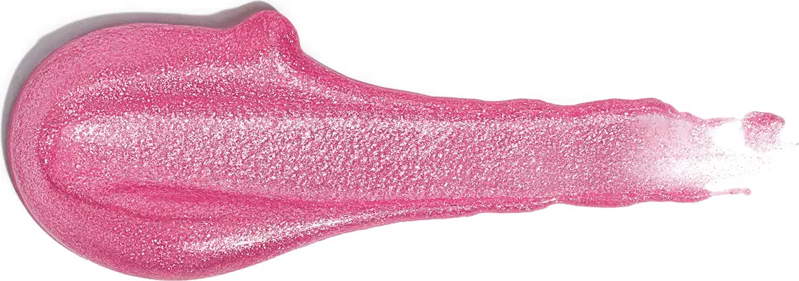 A imagem traz uma amostra do gloss labial com acabamento brilhante e cor rosa cintilante.