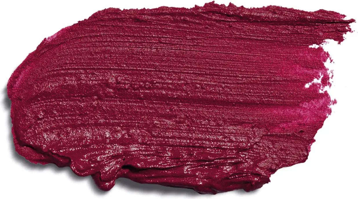 Textura cremosa e densa de tom pink espalhada sobre superfície branca, ocupando boa parte da imagem.