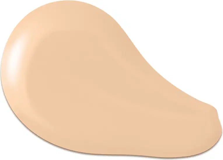 O produto apresentado na imagem é uma base de maquiagem de cor bege, com uma textura cremosa e suave. Sua forma é arredondada e convexa. Não há rótulos, marcas ou outras informações visíveis na imagem.