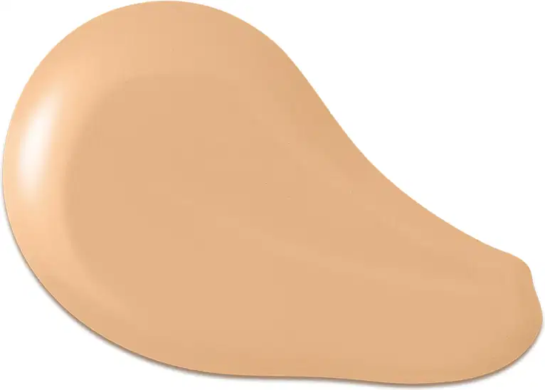 O produto apresentado na imagem é uma base de maquiagem de cor bege, com uma textura cremosa e suave. Sua forma é arredondada e convexa. Não há rótulos, marcas ou outras informações visíveis na imagem.