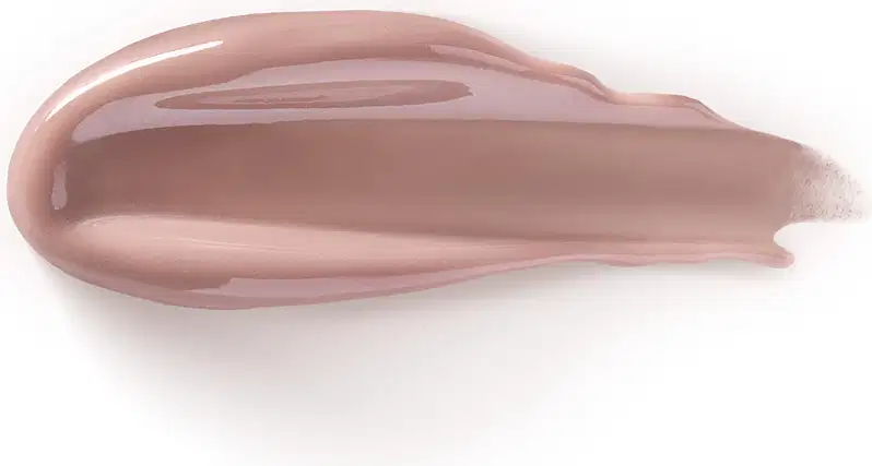 O produto de beleza apresenta uma textura cremosa, com uma tonalidade rosada suave e brilho sutil. Sua aparência é lisa e uniforme, sugerindo uma consistência macia e agradável ao toque.