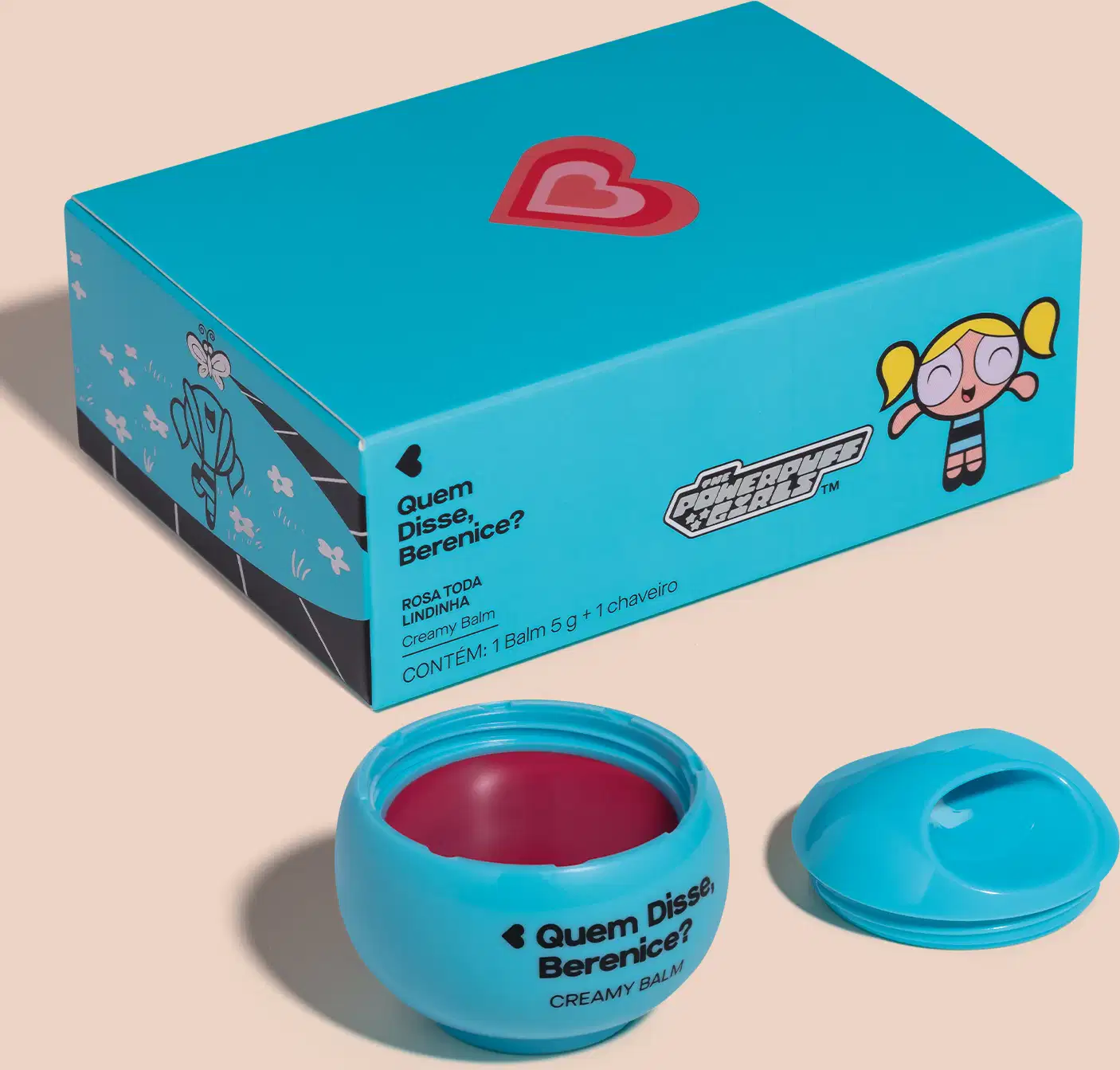 Caixa azul com logotipo e personagem da série Meninas Superpoderosas, contendo um pote de balm cremoso de cor rosa com tampa azul.