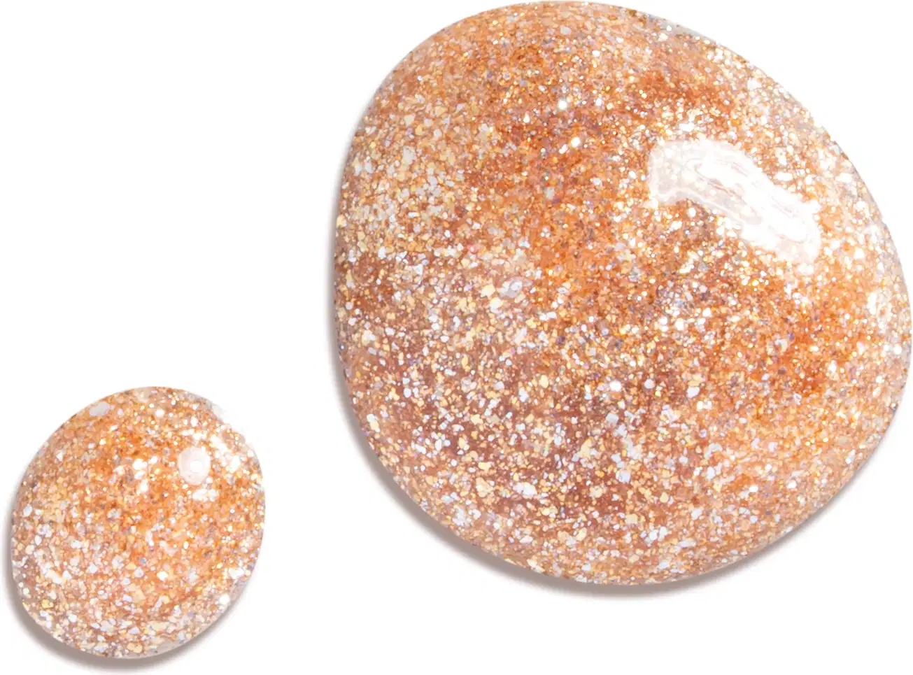 Esfera brilhante e granulada de delineador líquido dourado Expelliarmus Harry Potter Quem Disse, Berenice? na cor laranja-dourada, com aspecto de glitter, sobre superfície branca.
