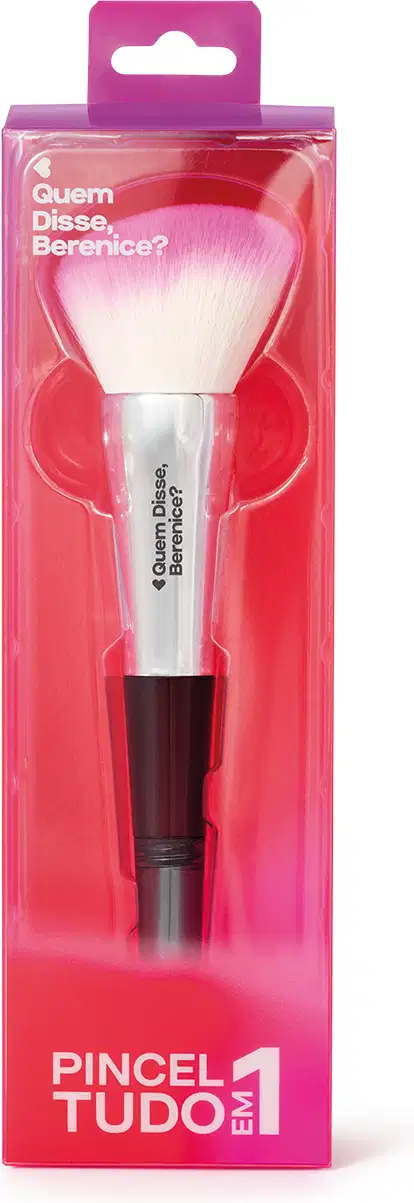 Pincel de maquiagem com cabo preto e cerdas brancas em embalagem rosa com texto em inglês. O produto é apresentado em uma caixa de plástico transparente com detalhes em rosa.