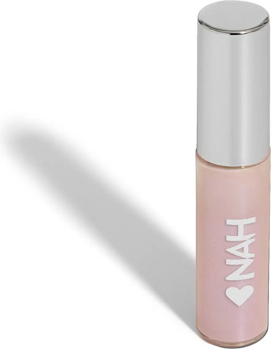Frasco de iluminador da marca Quem Disse, Berenice? em embalagem rosa clara com texto branco "NAH" e coração. Aplicador de espuma na ponta para aplicação suave do produto.
