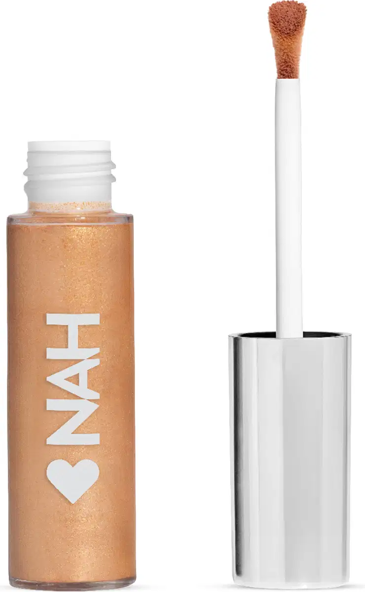 Frasco de item de make com aplicador de pó solto em formato de pincel, com rótulo branco exibindo a marca "NAH" em letras grandes.