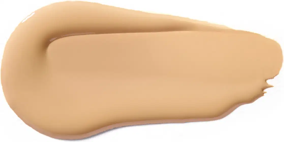 Textura cremosa e suave, com tonalidade bege clara, apresentando aspecto homogêneo e uniforme, típica de um produto de base ou corretivo da marca Vult.