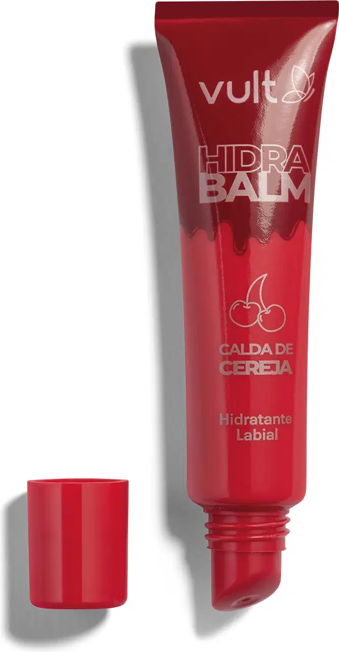 Tubo vermelho de hidratante labial da marca Vult com aplicador embutido. Rótulo em cores douradas com o texto Calda de Cereja em destaque. Embalagem com tampa vermelha, apresentando o nome do produto "Hidra Balm" em destaque.