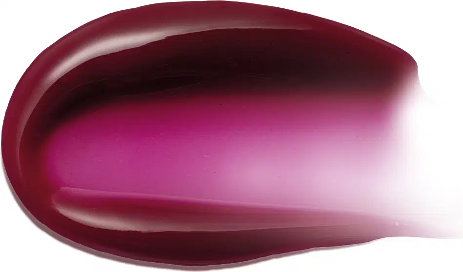 Imagem da textura cremosa e brilhante do hidratante labial, com gradiente de cor que varia do vermelho escuro ao rosa vibrante.