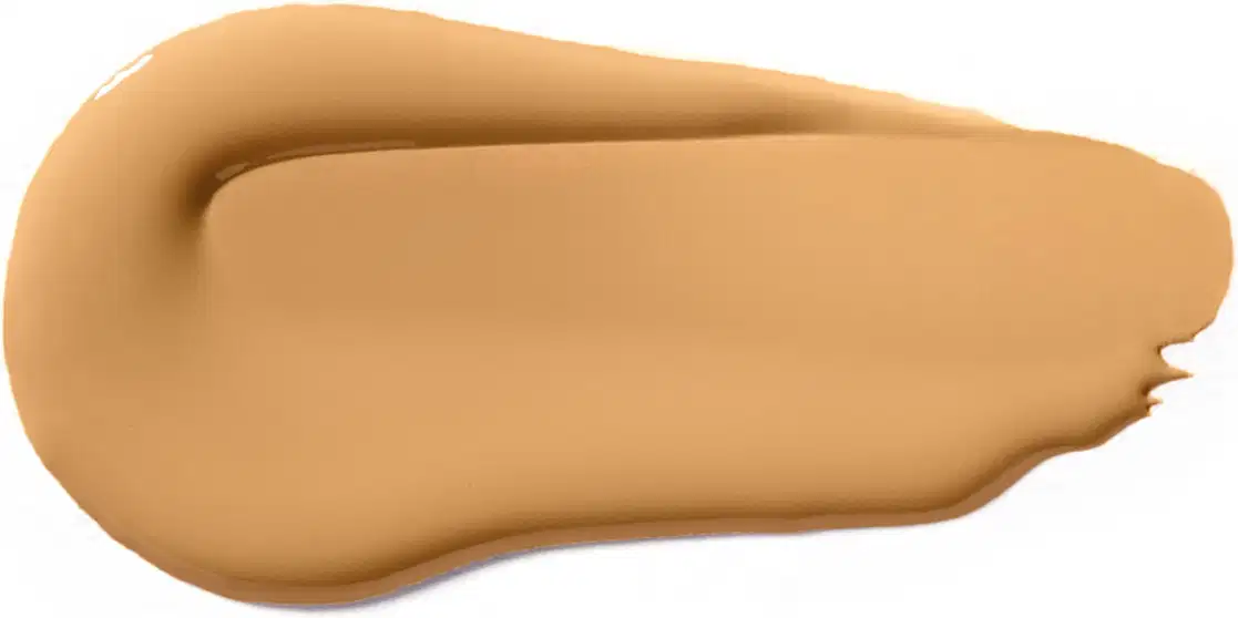 Textura cremosa e suave, com tonalidade bege clara, apresentando aspecto homogêneo e uniforme, típica de um produto de base ou corretivo da marca Vult.